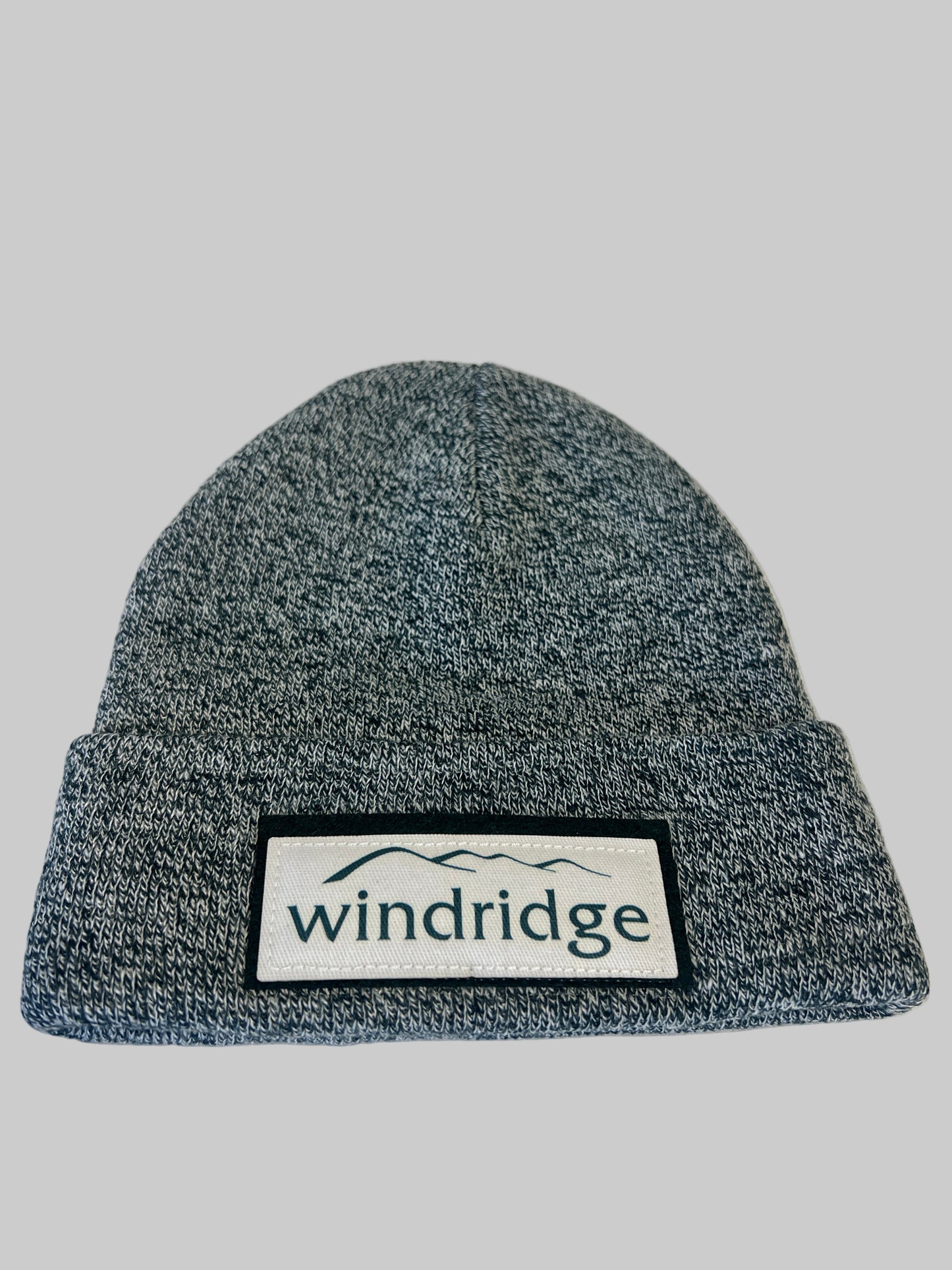 Gray knit beanie with 'windridge' logo on a white background