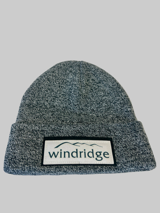 Gray knit beanie with 'windridge' logo on a white background